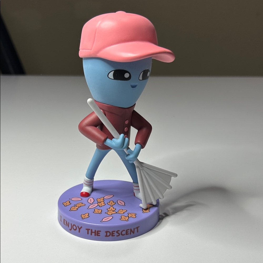 Nathan W. Pyle’s Strange Planet being raking leaves.